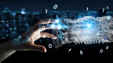 Businesswoman using wireframe holographic 3D digital projection