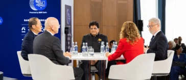 Piyush Goyal, India's Union Minister of Commerce and Industry, smiling at the circular panel table alongside international panellists at the Berlin Global Dialogue 2026